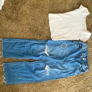 The white shirt is 9/10 and the jeans are 10 as the sizes including a bracelet.